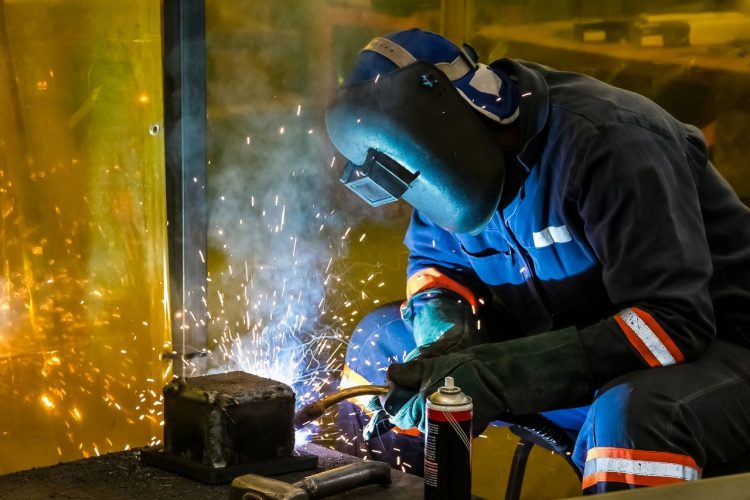 What are the advantages of using robot welders in car manufacturing?
