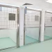 Why is hygienic wall cladding crucial in veterinary practices?